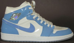 Air Jordan Retro 1 basketball shoe, white with Carolina blue trim and silver "Air Jordan Wings" logo