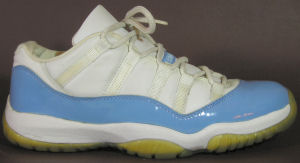 Air Jordan Retro 11 Low basketball shoe: White with Carolina blue trim