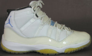 Air Jordan Retro 11 basketball shoe: white, with a Carolina blue JUMPMAN