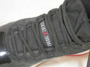 Tongue view of Air Jordan 11 Retro ("Jumpman Jordan" basketball shoe