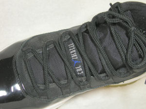 Tongue view of Air Jordan 11 Space Jam ("Jumpman Jam") basketball shoe