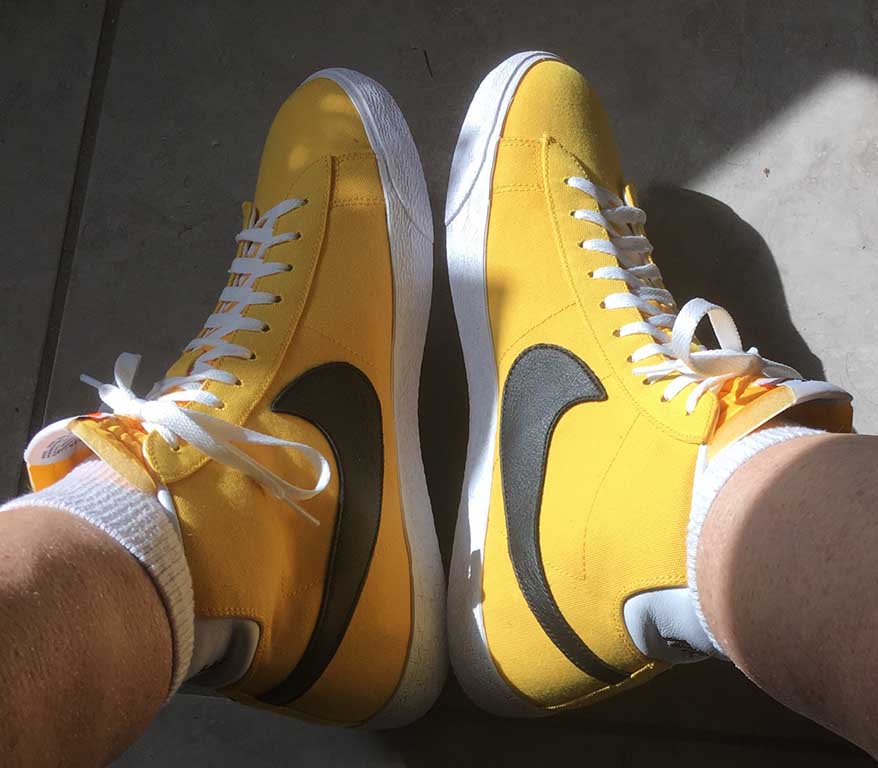 Gold canvas Nike Blazer hightops with black SWOOSH