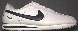 Nike Cortez shoe in white leather with black SWOOSH and midsole