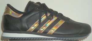The adidas Country Ripple sneaker in black with shiny gold stripes
