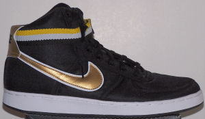 Nike Vandal high-top shoe: black with shiny gold and white SWOOSH and white and yellow ankle strap