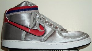 Nike Vandal Supreme high-top shoe: metallic silver with red and black SWOOSH, (red, black, and gray) ankle strap