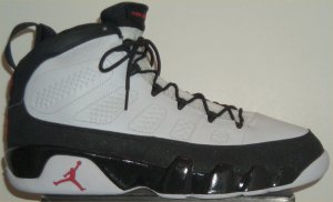 Air Jordan 9 basketball shoe in white with black trim and red JUMPMAN