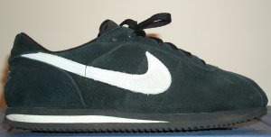 Nike Cortez shoe in black suede with gray SWOOSH and midsole