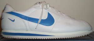 Nike Cortez shoe in white leather with Carolina blue SWOOSH and midsole