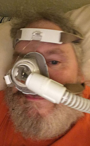 Philips Respironics True Blue nasal CPAP mask being worn by Charlie