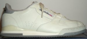Reebok Phase I tennis sneaker in off-white and gray