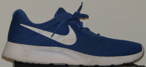 Blue Nike Tanjun sneakers with white SWOOSH