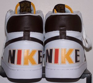 Heel view of Nike Terminator basketball shoes in white with brown/yellow/orange trim