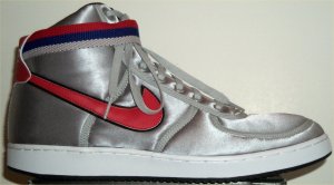 Metallic silver Nike Vandal hightops with red SWOOSH